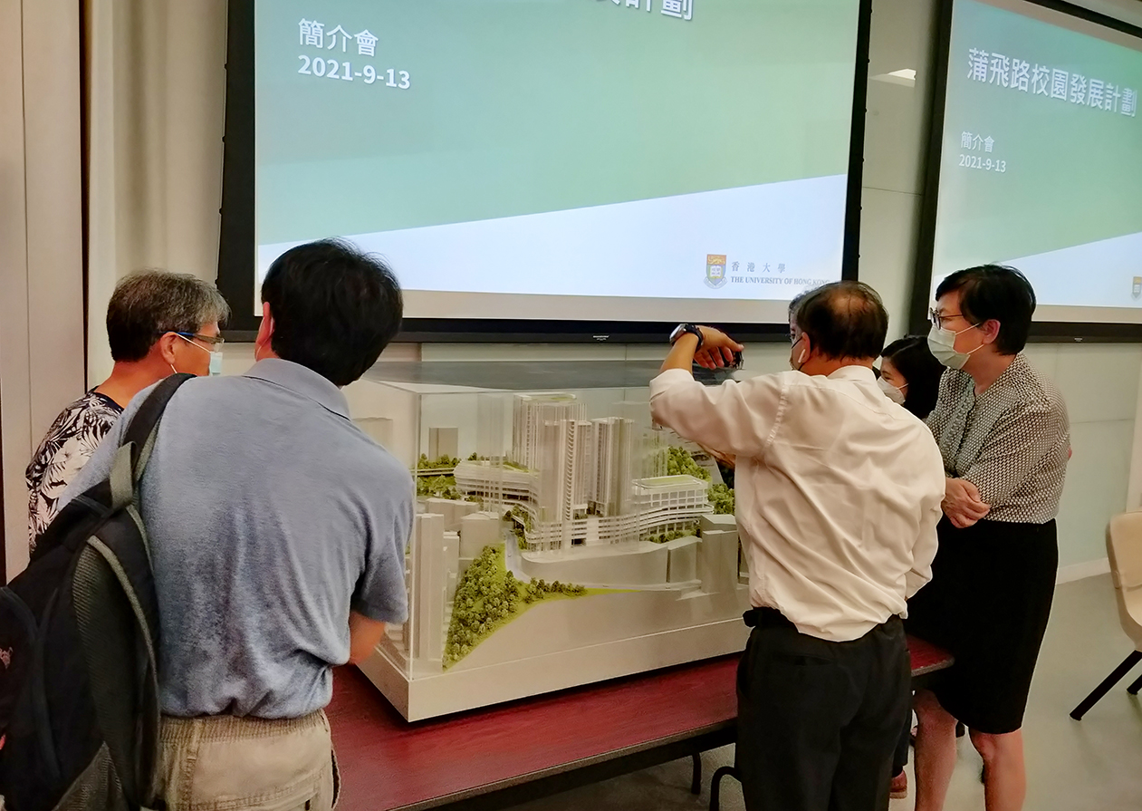 Participants and HKU representatives looking at the model at the Briefing Session held on 13 September 2021